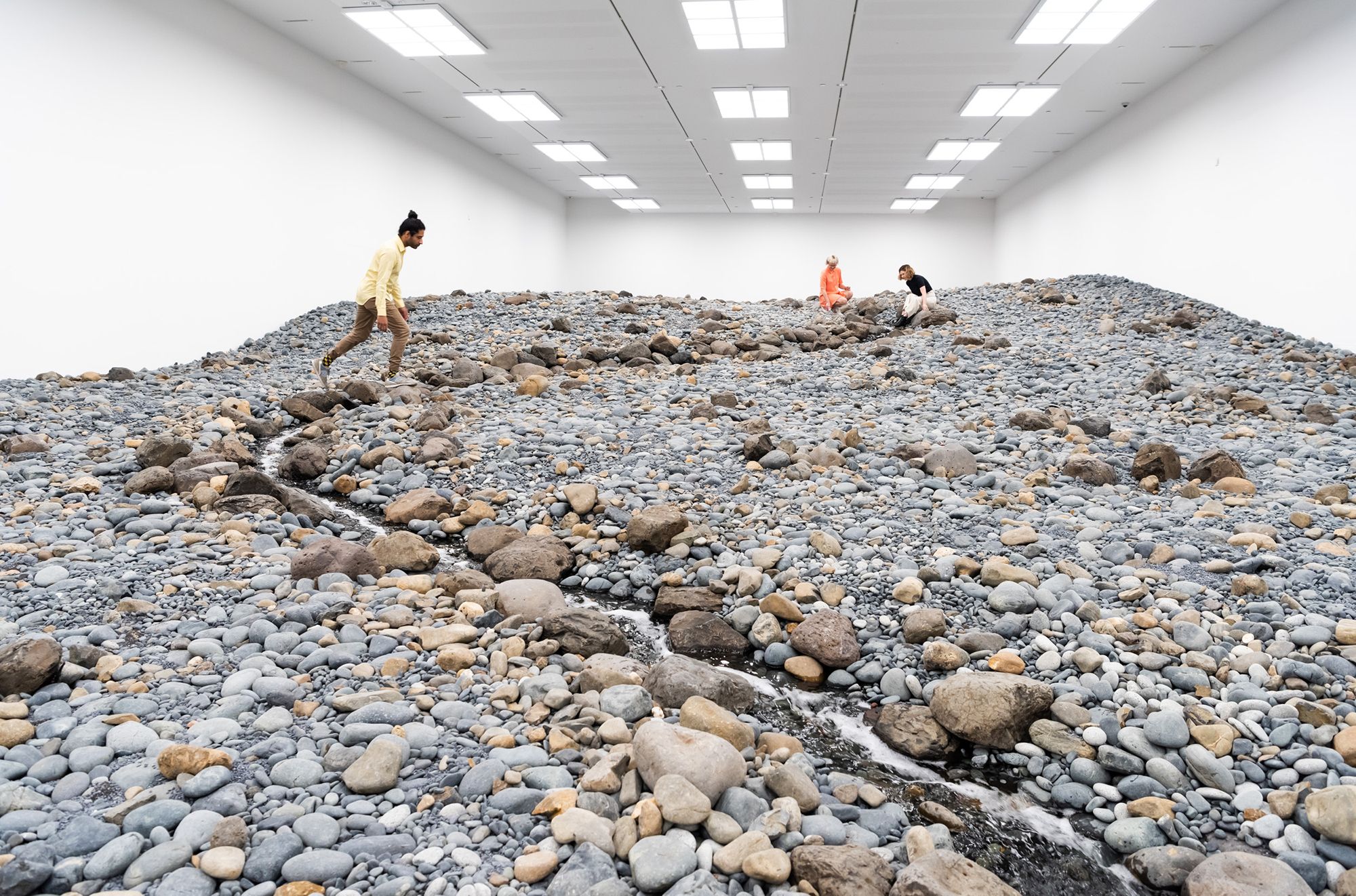 Olafur Eliasson, Denmark b.1967 / Riverbed 2014 (installation view, GOMA, 2019) / Water, rock (volcanic stones [blue basalt, basalt, lava], other stones, gravel, sand), wood, steel, plastic sheeting, hose, pumps / Purchased 2021. The Josephine Ulrick and Win Schubert Charitable Trust / Collection: The Josephine Ulrick and Win Schubert Charitable Trust, Queensland Art Gallery | Gallery of Modern Art / © 2014 Olafur Eliasson / Photograph: N Harth © QAGOMA