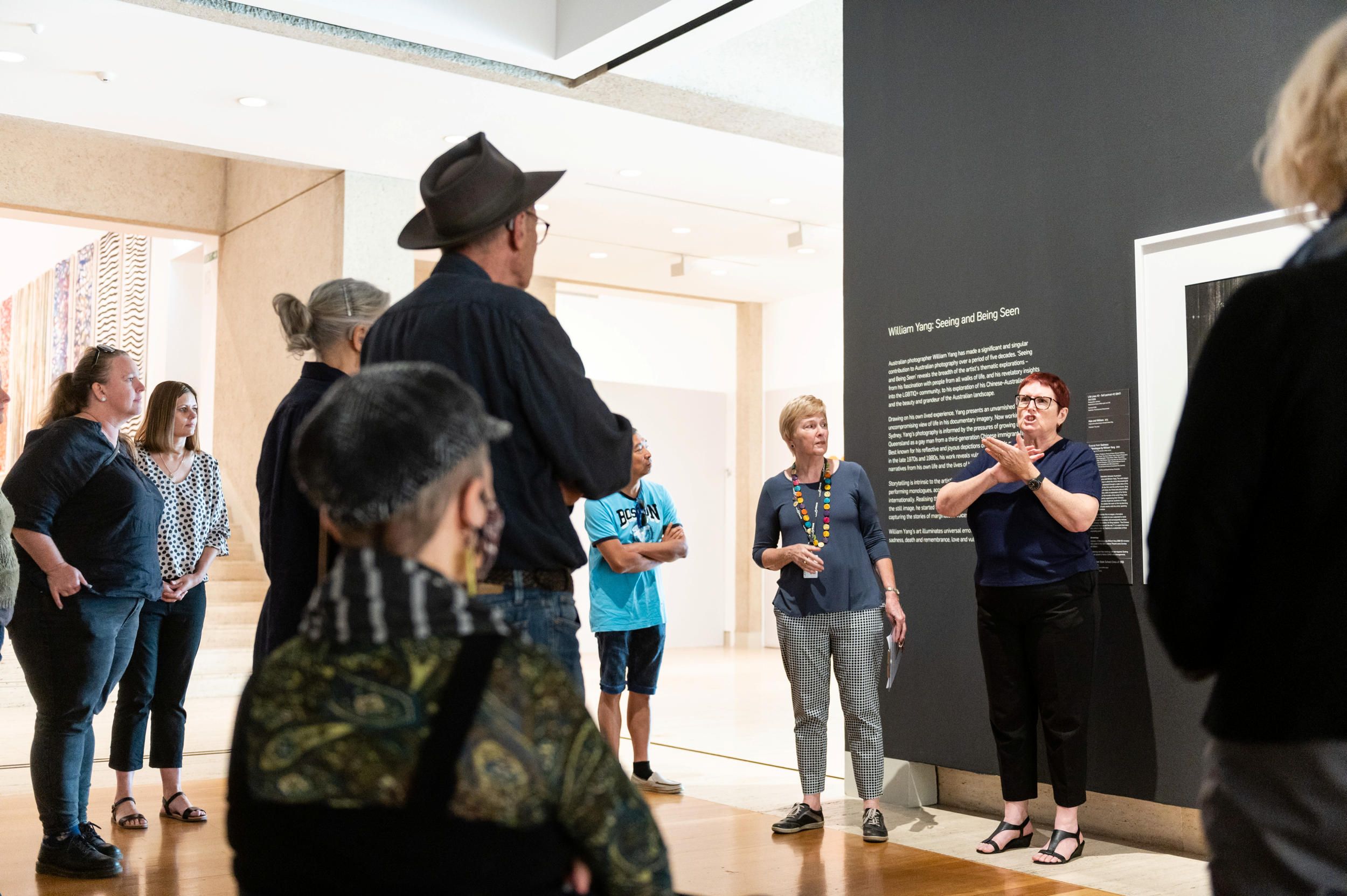 Visitors on an Auslan interpreted tour at QAG | Photograph: M Pricop