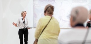 A volunteer guided tour for visitors with hearing loss. Photograph: C. Callistemon © QAGOMA