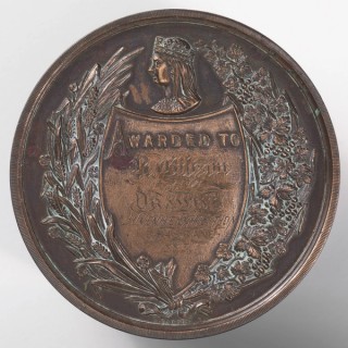 Robert Capner, England/ Queensland Australia 1833–99 / National Agricultural and Industrial Association of Queensland medallion presented to Bessie Gibson - First Prize, Drawing, Juvenile Exhibition, 1883 1883 / Bronze / 7.2 (diam.) x .6cm / Gift of Dr W Lockhart Gibson 1975 / Collection: Queensland Art Gallery | Gallery of Modern Art