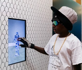 A visitor explores digital interactives within the ‘European Masterpieces from the Metropolitan Museum of Art, New York’ exhibition, GOMA, June 2021 / Photograph: Marc Grimwade