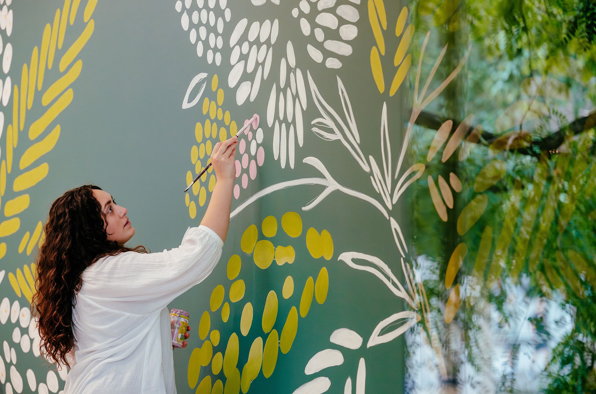 Tamika Grant-Iramu, Papua New Guinean, European and Torres Strait Islander heritage, Australia b.1995 / A Verdant Landscape 2025 / Hand-painted mural, design derived from original relief-print on paper / Commissioned 2025 for the QAG Cafe with funds from the QAGOMA Foundation / Photograph: J Ruckli © QAGOMA