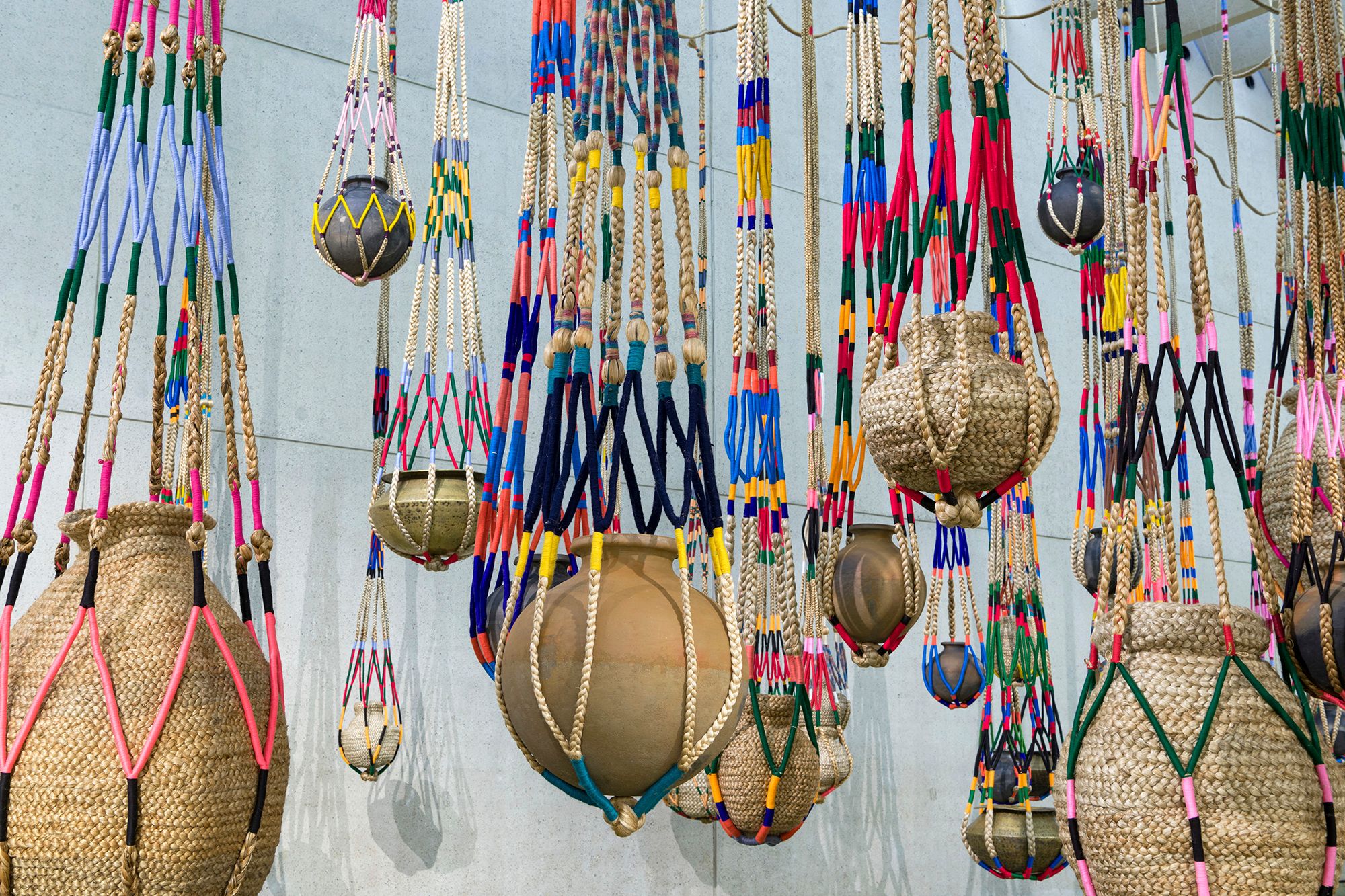 Kamruzzaman Shadhin, Bangladesh b.1974 / Gidree Bawlee Foundation of Arts Bangladesh, est. 2001; Collaborating artists: Johura Begum, Monowara Begum, Majeda Begum, Fatema Begum (1), Shabnur Begum, Chayna Begum, Fatema Begum (2), Samiron Begum, Shirina Begum, Rekha, Nasima Begum, Shushila Rani, Protima Rani, Akalu Barman / The fibrous souls 2018–21 / Jute, cotton, thread, clay, brass / 70 pots: 40–100cm each (diam.) (approx.) with 70 shikas of various dimensions / Originally commissioned by Samdani Art Foundation / Purchased 2021 with funds from Metamorphic Foundation through the Queensland Art Gallery | Gallery of Modern Art Foundation / Collection: Queensland Art Gallery | Gallery of Modern Art / © The artists / Photograph: C. Callistemon © QAGOMA