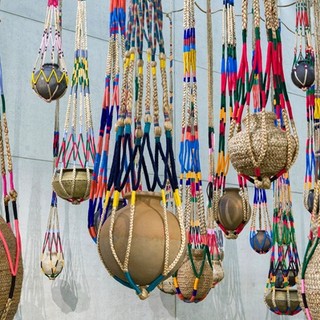 Kamruzzaman Shadhin, Bangladesh b.1974 / Gidree Bawlee Foundation of Arts Bangladesh, est. 2001; Collaborating artists: Johura Begum, Monowara Begum, Majeda Begum, Fatema Begum (1), Shabnur Begum, Chayna Begum, Fatema Begum (2), Samiron Begum, Shirina Begum, Rekha, Nasima Begum, Shushila Rani, Protima Rani, Akalu Barman / The fibrous souls 2018–21 / Jute, cotton, thread, clay, brass / 70 pots: 40–100cm each (diam.) (approx.) with 70 shikas of various dimensions / Originally commissioned by Samdani Art Foundation / Purchased 2021 with funds from Metamorphic Foundation through the Queensland Art Gallery | Gallery of Modern Art Foundation / Collection: Queensland Art Gallery | Gallery of Modern Art / © The artists / Photograph: C. Callistemon © QAGOMA