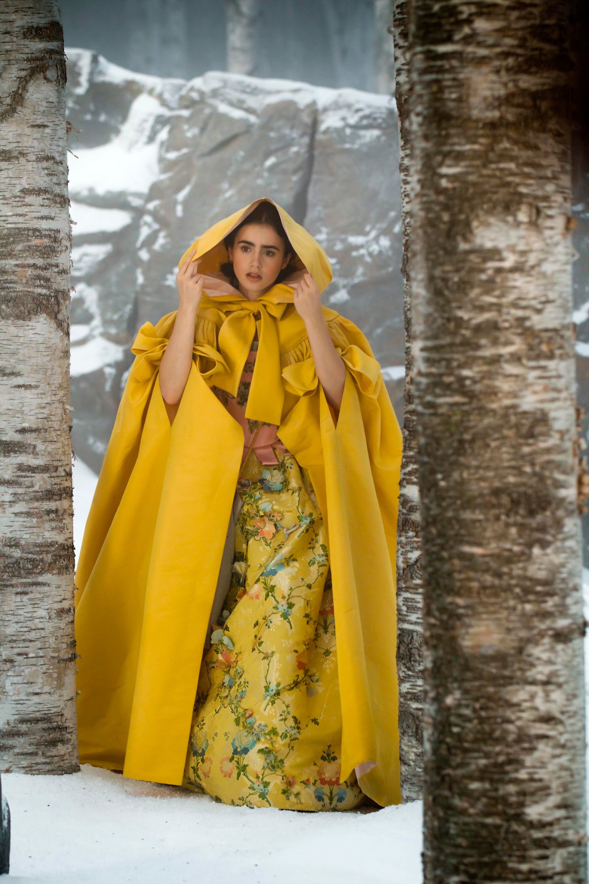 Promotional image from Mirror Mirror 2012 showing ‘Yellow dress with hood’ worn by Lily Collins as ‘Princess Snow’ / Director: Tarsem Singh / © 2012 UV RML NL Assets LLC. / Photograph: Jan Thijs