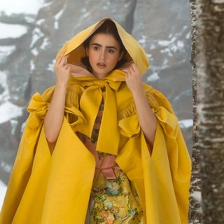 Promotional image from Mirror Mirror 2012 showing ‘Yellow dress with hood’ worn by Lily Collins as ‘Princess Snow’ / Director: Tarsem Singh / © 2012 UV RML NL Assets LLC. / Photograph: Jan Thijs