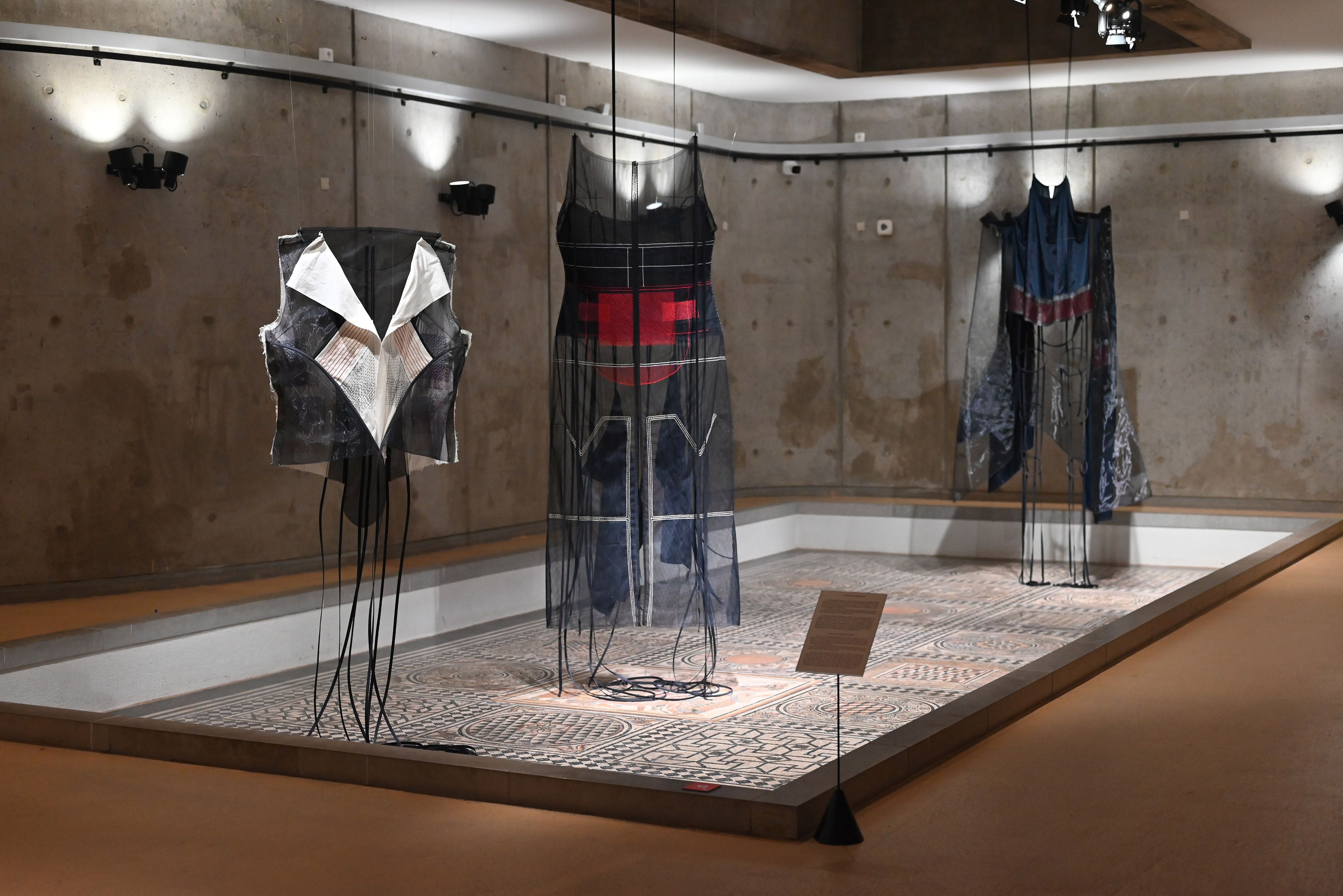Filwa Nazer / Swansea, United Kingdom, b.1972 / Installation view of Five women 2021 at the Biennale de Lyon 2022 / Mixed media, including navy antistatic lining, black latex, piping cord, cotton-covered plastic boning, nylon interlining, calico cotton, nylon tulle, matt rubber, poly-rubber fabric, cotton webbing / Five components (installed dimensions variable) / Commissioned by the Diriyah Biennale Foundation / Collection: Museums Commission, Ministry of Culture, Kingdom of Saudi Arabia / Image courtesy: The artist