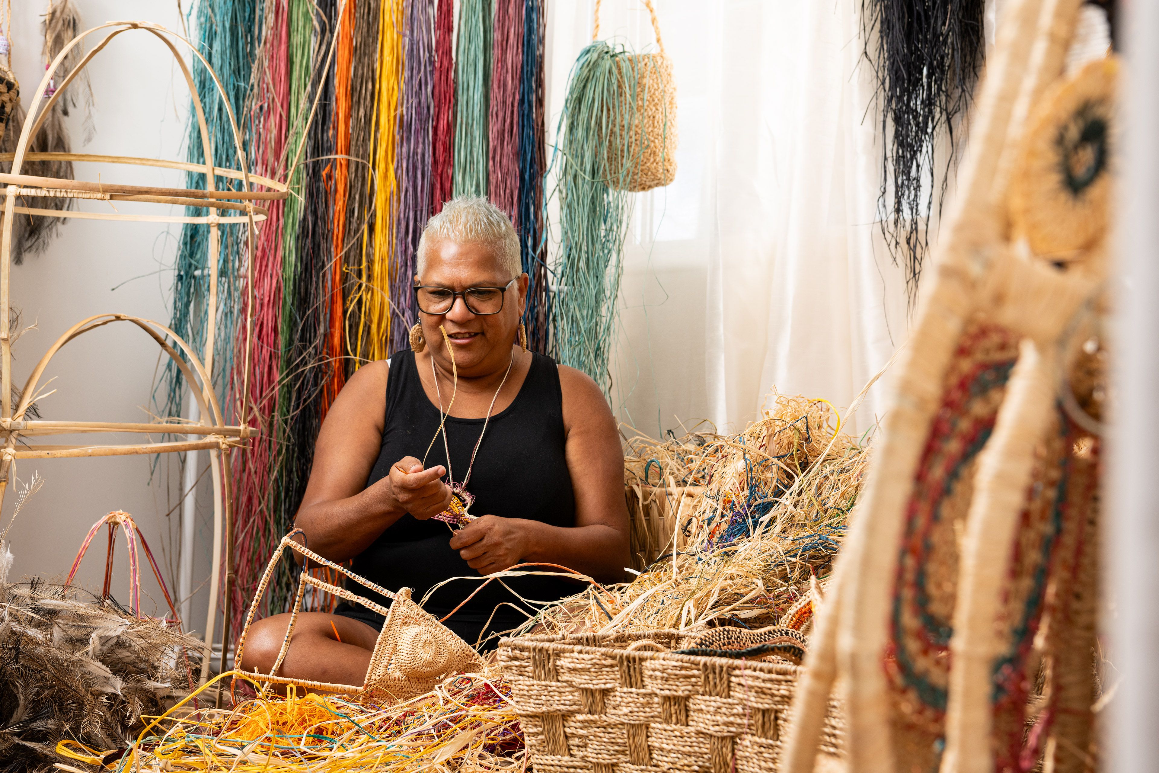 Asia Pacific Triennial artist Kim Ah Sam (Kalkadoon/Kuku Yalanji) weaving in her studio / Photograph: C Callistemon © QAGOMA