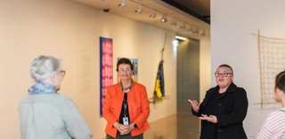 An Auslan interpreter accompanies a volunteer guide on a tour for d/Deaf visitors at the Gallery of Modern Art. Photograph: K. Bennett