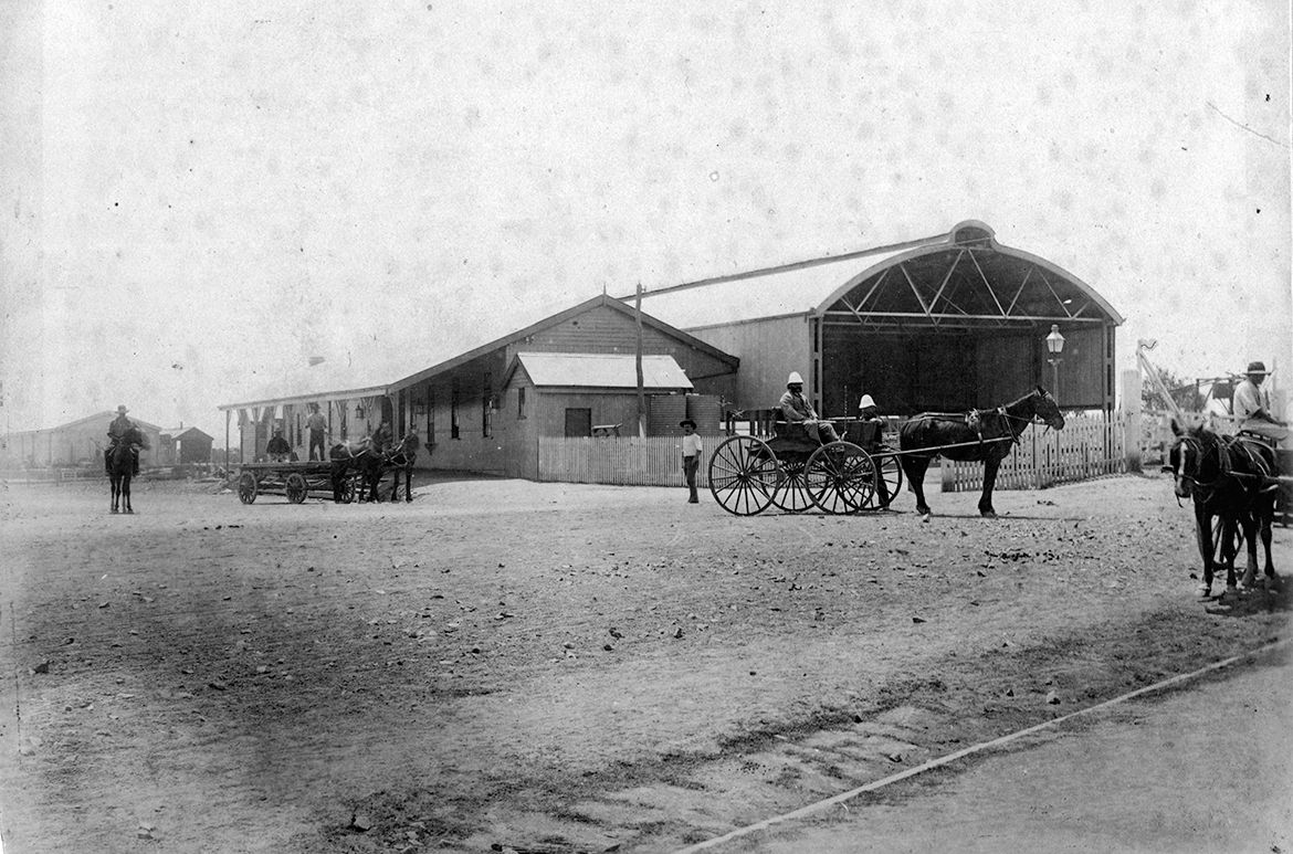 Charters Towers railway station, c. 1888 / 75511 / Courtesy: John Oxley Library, State Library of Queensland, Brisbane / Photograph of the wooden station building adjoining the covered station platform at the Charters Towers rail terminus, the railway to Charters Towers opened in 1884.