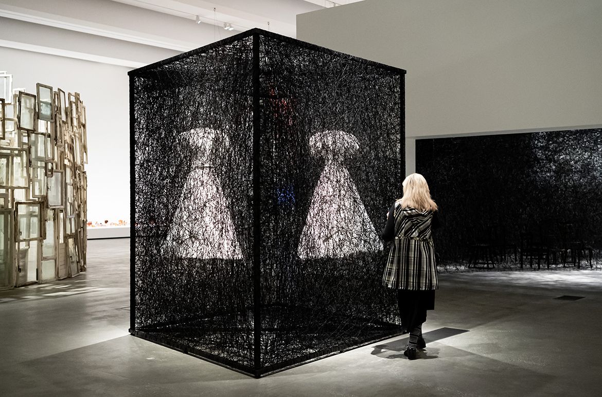 Chiharu Shiota, Japan/Germany b.1972 / Reflections of Space and Time 2018/2022/ Installation view in ‘Chiharu Shiota: The Soul Trembles’, Gallery of Modern Art, Brisbane, 2022 / White dress, mirror, metal frame, Alcantara black thread / 280 x 300 x 400cm / Commissioned by Alcantara S.p.A / © Chiharu Shiota / Photograph: C Callistermon © QAGOMA