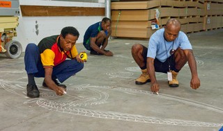 Artists from Papua New Guinea prepare a layout for the construction of a representation of an Abelam House, to be constructed as part of the 7th Asia Pacific Triennial at the Queensland Art Gallery, Brisbane in 2012