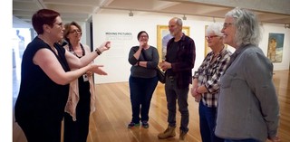 An Auslan interpreter accompanies guided tours for Deaf visitors