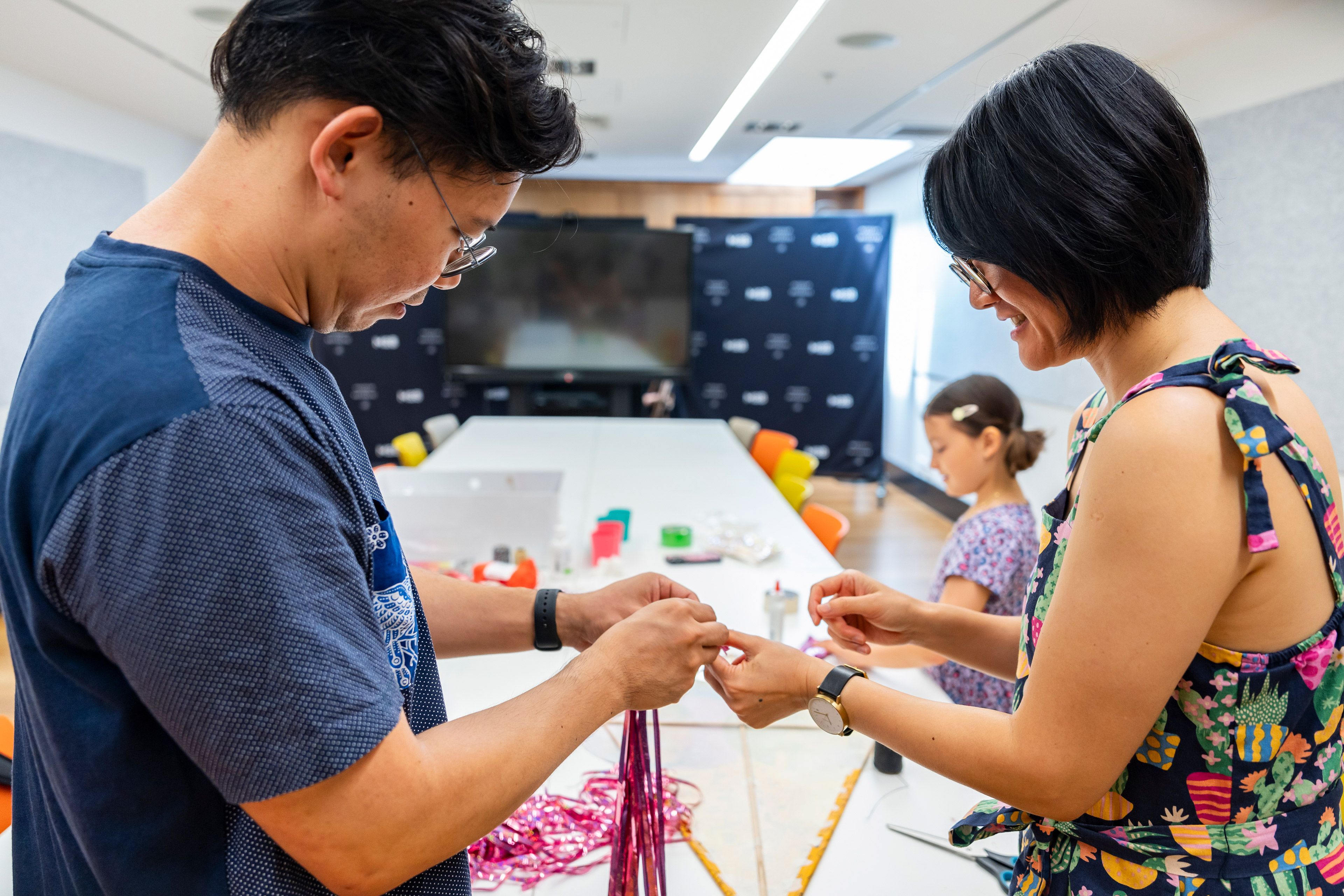 Louis Lim (left) and Christine Ko (right) conducting a workshop through their project 'Departure' with participant Amelia at the Museum of Brisbane. Photo: Haline Ly