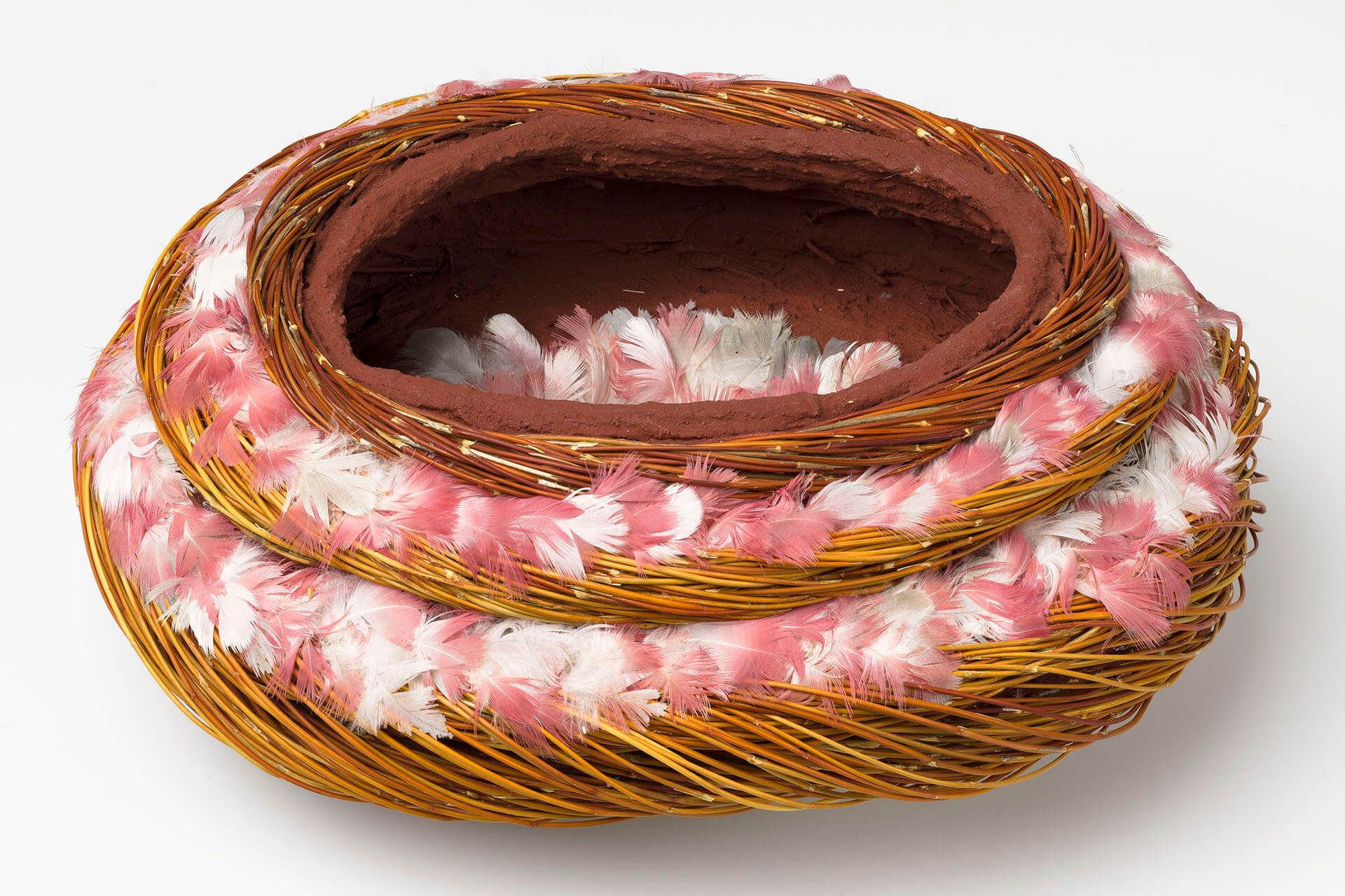 Shirley Macnamara, Australia b.1949 / Erkel (Vessel) 2010 / Twined spinifex (Triodia longiceps) with nylon thread, red ochre, galah feathers and synthetic polymer fixative / 14 x 31 x 25cm / Purchased 2010 with funds from the Bequest of Grace Davies and Nell Davies through the Queensland Art Gallery Foundation / Collection: Queensland Art Gallery | Gallery of Modern Art / © Shirley Macnamara