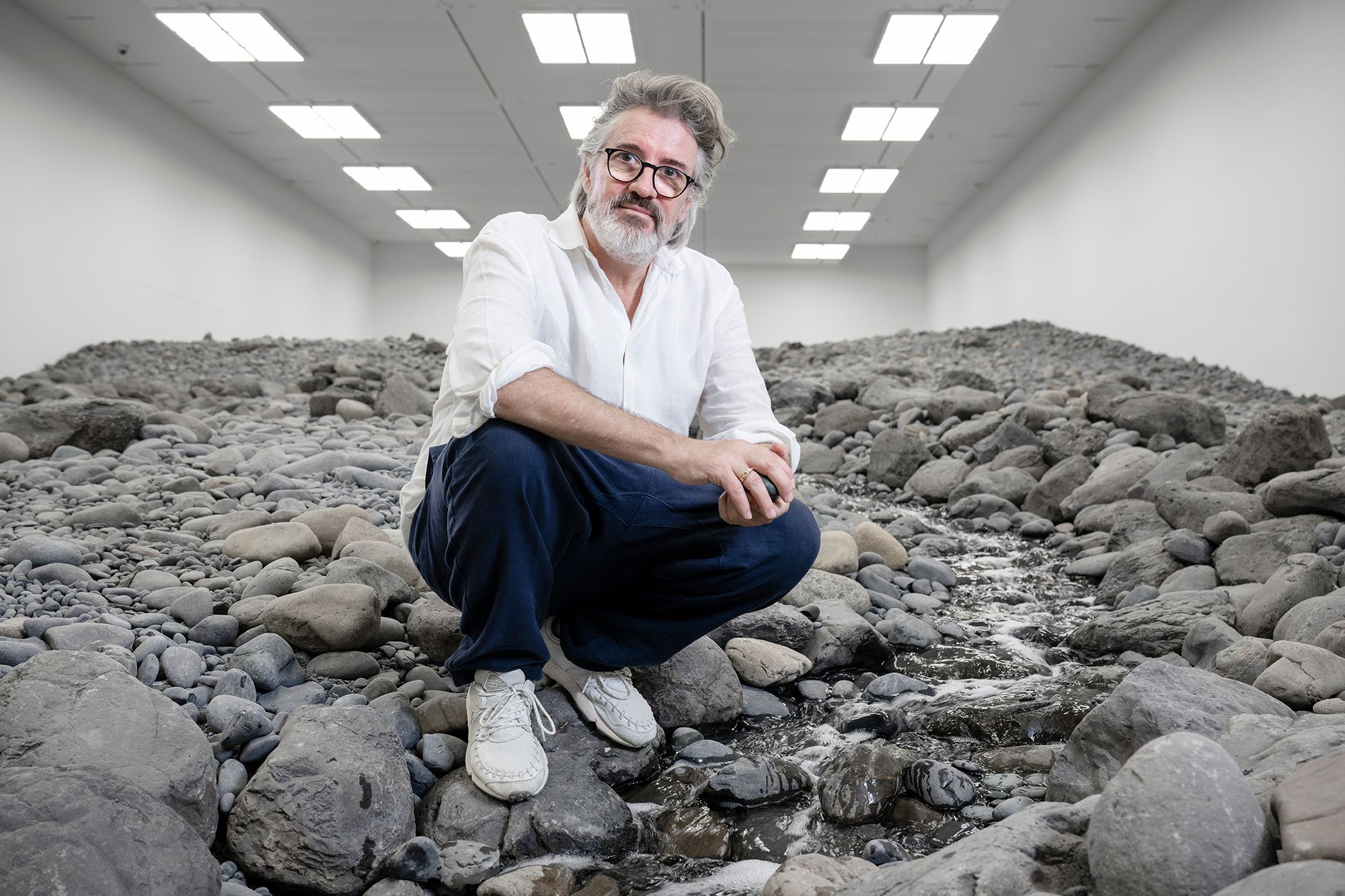 Olafur Eliasson, Denmark b.1967 / Riverbed 2014 (installation view, GOMA, 2025) / Water, rock (volcanic stones [blue basalt, basalt, lava], other stones, gravel, sand), wood, steel, plastic sheeting, hose, pumps / Purchased 2021. The Josephine Ulrick and Win Schubert Charitable Trust. Collection: The Josephine Ulrick and Win Schubert Charitable Trust, QAGOMA / Collection: Queensland Art Gallery | Gallery of Modern Art / © 2014 Olafur Eliasson / Photograph: J Ruckli © QAGOMA