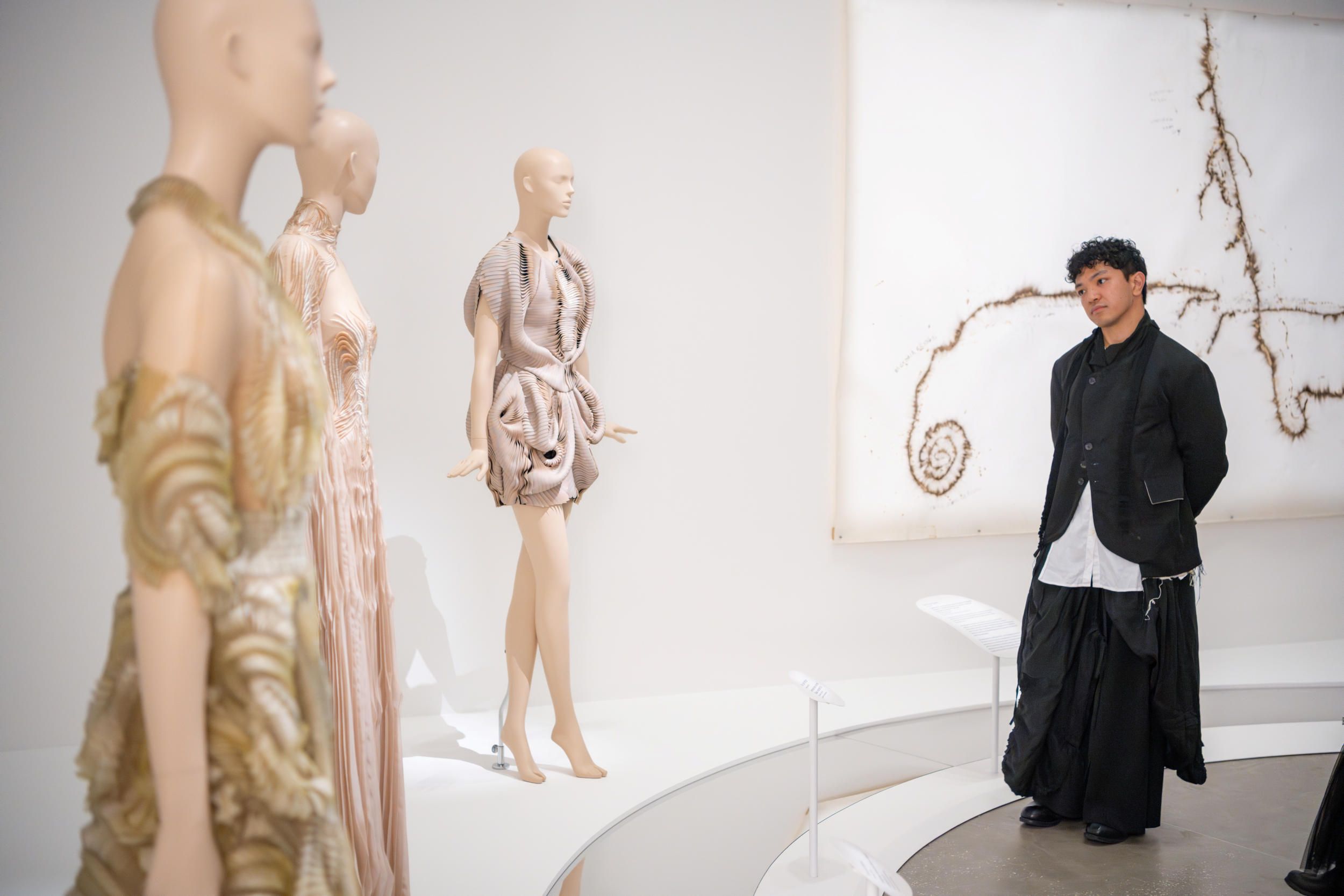 Patron enjoying the art within Iris van Herpen: Sculpting the Senses / June, 2024 / Gallery of Modern Art, Brisbane / Photography: N. Umek, QAGOMA