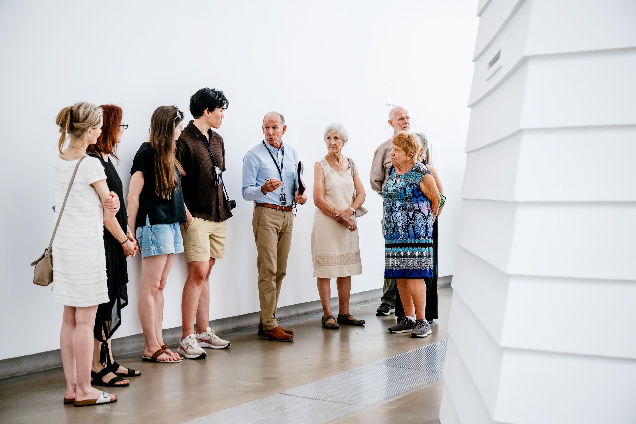 A Volunteer Guide leads visitors on a tour at GOMA. / Photography: Joe Ruckli / © QAGOMA 