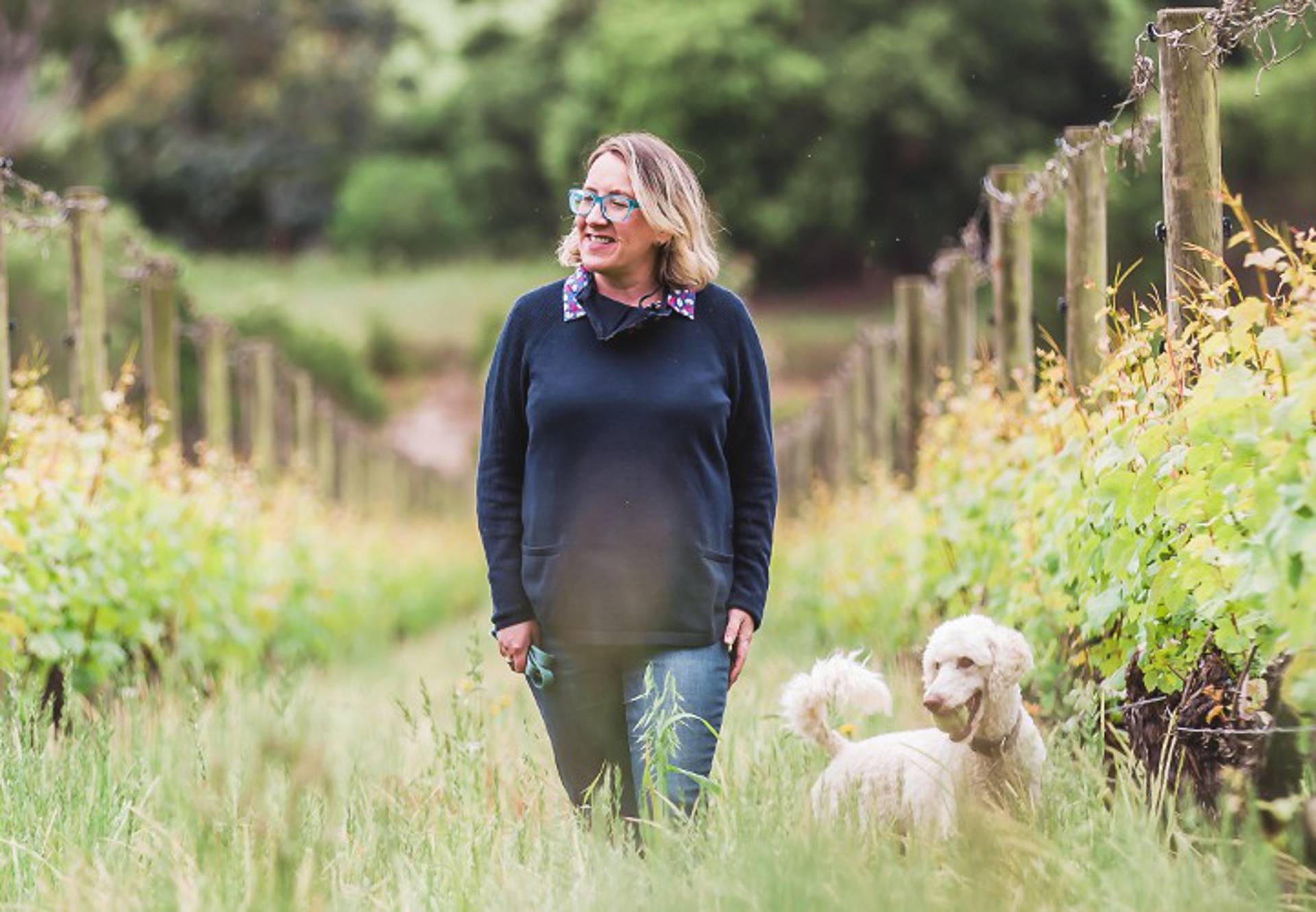 Kate McIntyre, Master of Wine, in the McIntyre vineyard with Polly