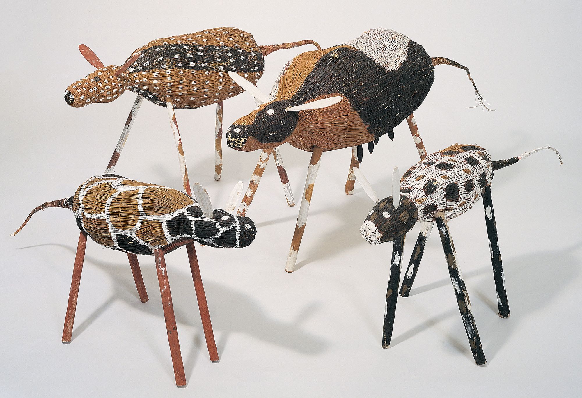 Lena Yarinkura, Kune/Rembarrnga people, Australia b.1961 / Jamu (dog) 2003; 7 parts:42 x 108 x 33cm (complete) / Jamu (dog) 2003; 7 parts:50 x 102 x 28cm (complete) / Jamu (dog) 2003; 7 parts: 62 x 122.5 x 58cm (complete) / Jamu (dog) 2003; 15 parts:72 x 163 x 45cm (complete) / Purchased 2004.QAG Foundation Grant / Collection: Queensland Art Gallery | Gallery of Modern Art / © Lena Yarinkura /Copyright Agency