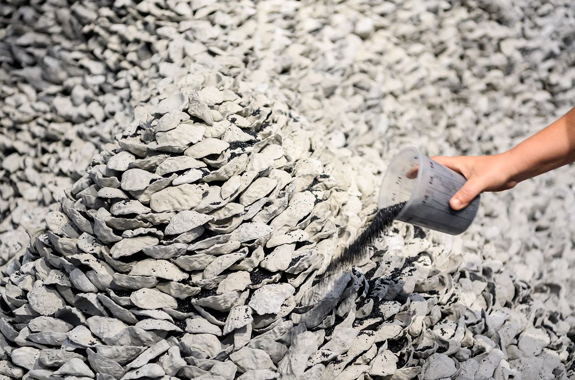 Megan Cope, Quandamooka people, Australia b.1982 / RE FORMATION 2019 / 12 000 pieces of cast-concrete, ilmenite / Purchased 2019 with funds from the Contemporary Patrons through the Queensland Art Gallery | Gallery of Modern Art Foundation / Collection: Queensland Art Gallery | Gallery of Modern Art / © Megan Cope