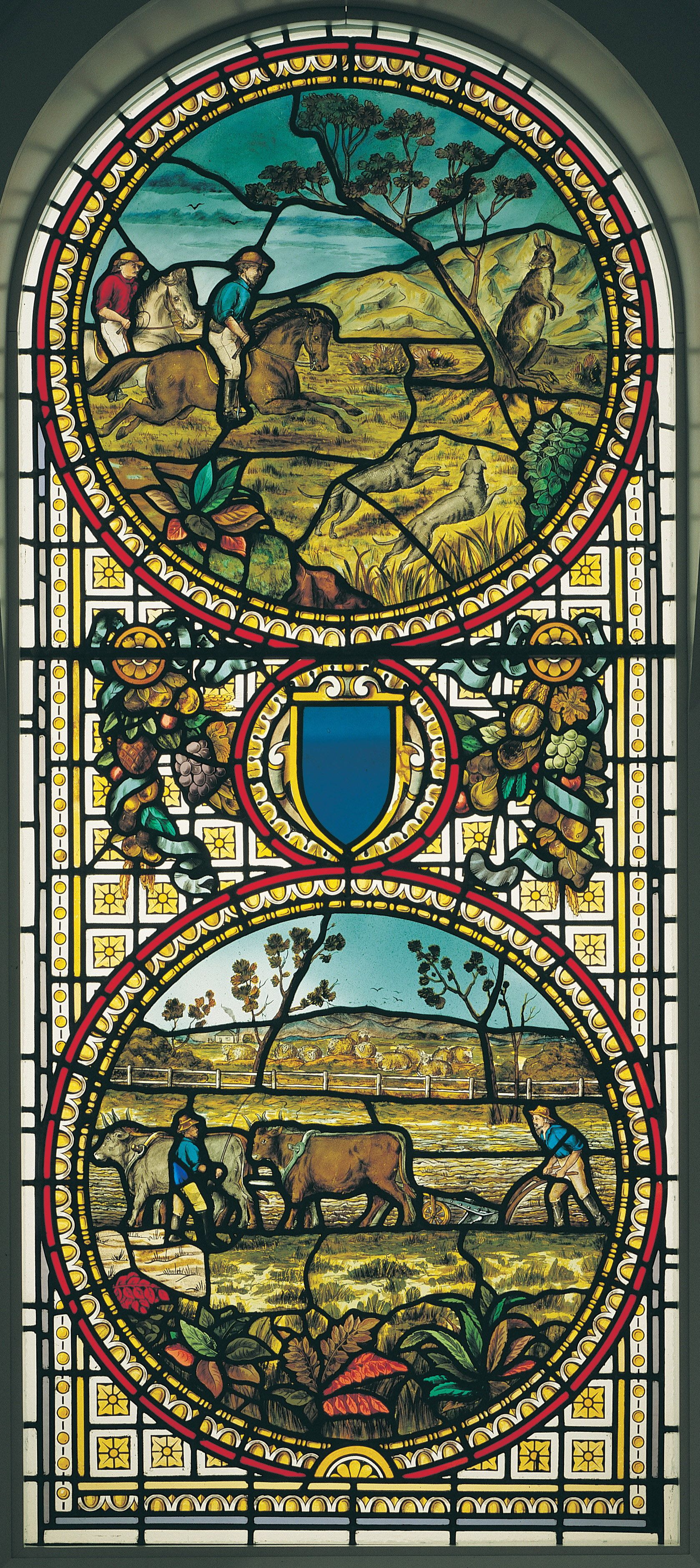 Unknown, Ireland / Sidney House stained glass window c.1882 / Coloured and stained glass window in two panels; the upper (arched) panel depicting a kangaroo hunt and the lower a farming scene / 204 x 88cm / Gift of the Australian Broadcasting Corporation, Brisbane 1988 / Collection: Queensland Art Gallery | Gallery of Modern Art