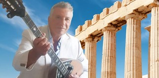 George Bousias playing Bouzouki, alongside the Greek Parthenon / Image Courtesy: George Bousias