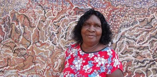 Mavis Ngallametta with her monumental work Kendall River #1 2012 / Photograph: Martin Browne