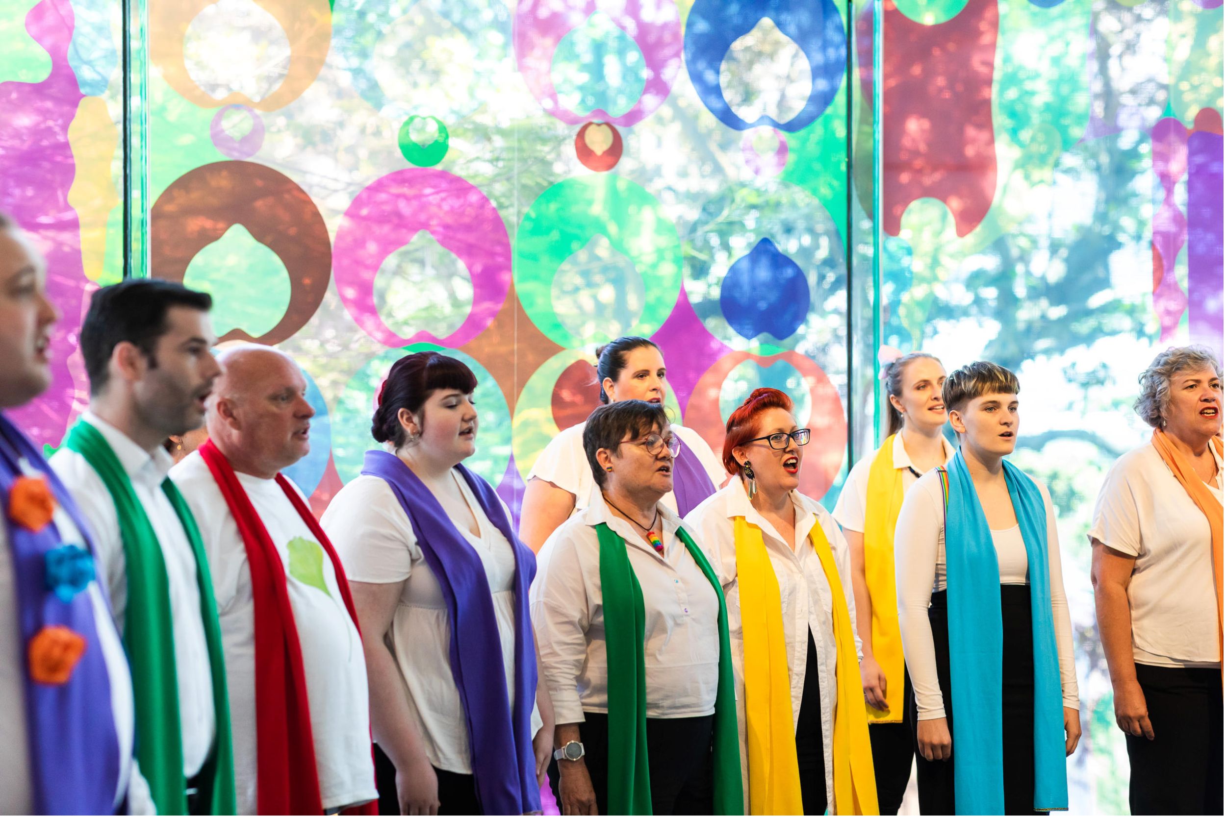 Brisbane Pride Choir performing at APT10 Opening Weekend in front of Shannon Novak's APT10 artwork, 81 Percent (Australia): Someone you know (from 'Make Visible: Queensland') (installation view) 2021 / December 2021 / Gallery of Modern Art / Photography: Katie Bennett, QAGOMA