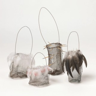 Lorraine Connelly-Northey, Waradgerie people, Australia b.1962 / Narrbong (String bag) 2007, Rusted gauze wire with white pelican down, 24.5 x 10 x 10cm / Narrbong (String bag) 2007, Rusted gauze wire with black pelican down, 24 x 9 x 9cm / Narrbong (String bag) 2007, Rusted gauze wire with galah feathers and pelican down, 15 x 8 x 8cm / Narrbong (String bag) 2007, Rusted gauze wire with echidna quills, 33.5 x 8 x 9cm / Purchased 2008. The Queensland Government’s Gallery of Modern Art Acquisitions Fund / Collection: Queensland Art Gallery | Gallery of Modern Art / © Lorraine Connelly-Northey