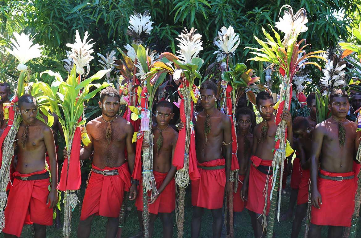 Gunantuna (Toloi people) / Initiates with Diwarra (shell money) fees and Rumu (ceremonial spears) as part of Gunantuna Nidok (initiation) ceremony, East New Britain, July 2017 / Proposed for the Collection Queensland Art Gallery / Image courtesy: Gideon Kakabin (photographer)