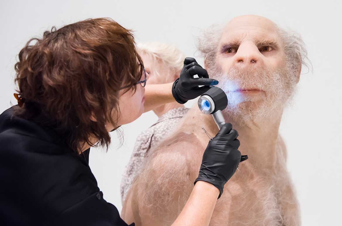 Conservator Catherine Collyer condition reporting The Carrier in preparation for the exhibition opening.

Patricia Piccinini, Australia b.1965 / The Carrier 2012 / Silicone, fibreglass, human hair, animal fur / ed. 1/1 + 1 AP / 170 x 115 x 75cm / Lyon Collection, Lyon Housemuseum, Melbourne / © The artist