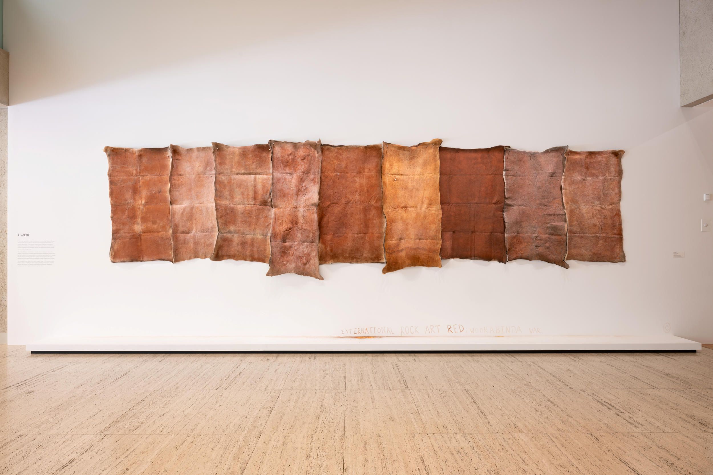 D Harding / Bidjara, Ghungalu and Garingbal people, Australia b.1982 / Woori red 2024 / Ghungalu red soil, gum acacia, wool felt, farrier nails / Nine blankets: 110 x 180cm (each, approx.) / Artwork supported by members
of the Harding and Lawton families / Courtesy: The artist and Milani Gallery, Meanjin/Brisbane / Photograph: Chloë Callistemon, QAGOMA