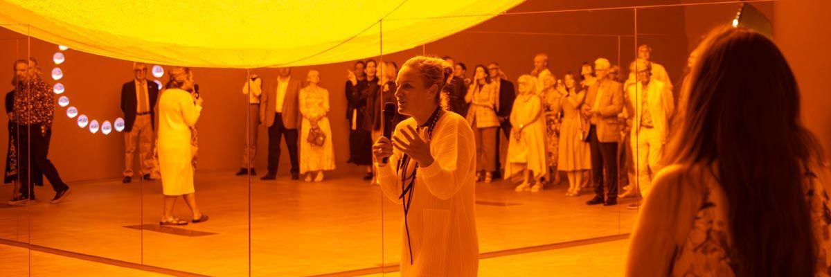 Geraldine Kirrihi Barlow giving a guided tour of the exhibition 'Presence'
