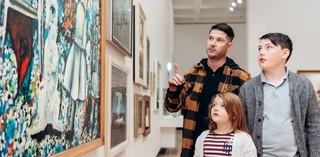 Visitors exploring the Australian art collection, featuring Charles Blackman’s The Blue Alice 1956–57 (Purchased 2000. The Queensland Government's special Centenary Fund / © Charles Blackman/Copyright Agency, 2022), in the Josephine Ulrick and Win Schubert Galleries (10–13), QAG, July 2020 / Photograph: J Ruckli