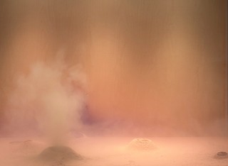 Dora Budor, Croatia b.1984 / Origin II (Burning of the Houses) 2019 / Custom environmental chamber (reactive electronic system, compressor, valves, 3D printed elements, aluminium, acrylic, LED light, glass, wood, paint), organic and synthetic pigments, diatomaceous earth, FX dust, felt, ed. 3/3 / One of three chambers: 152 x 160 x 86cm (each) / Purchased 2021. Queensland Art Gallery | Gallery of Modern Art Foundation / Collection: Queensland Art Gallery | Gallery of Modern Art / © Dora Budor / Photograph: M Campbell © QAGOMA