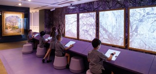 Students participate in Gary Carsley’s interactive project ‘Purple Reign’, inspired by R Godfrey Rivers’s Under the Jacaranda 1903 (far left), during APT9 Kids, October 2018 / Photograph: C Callistemon