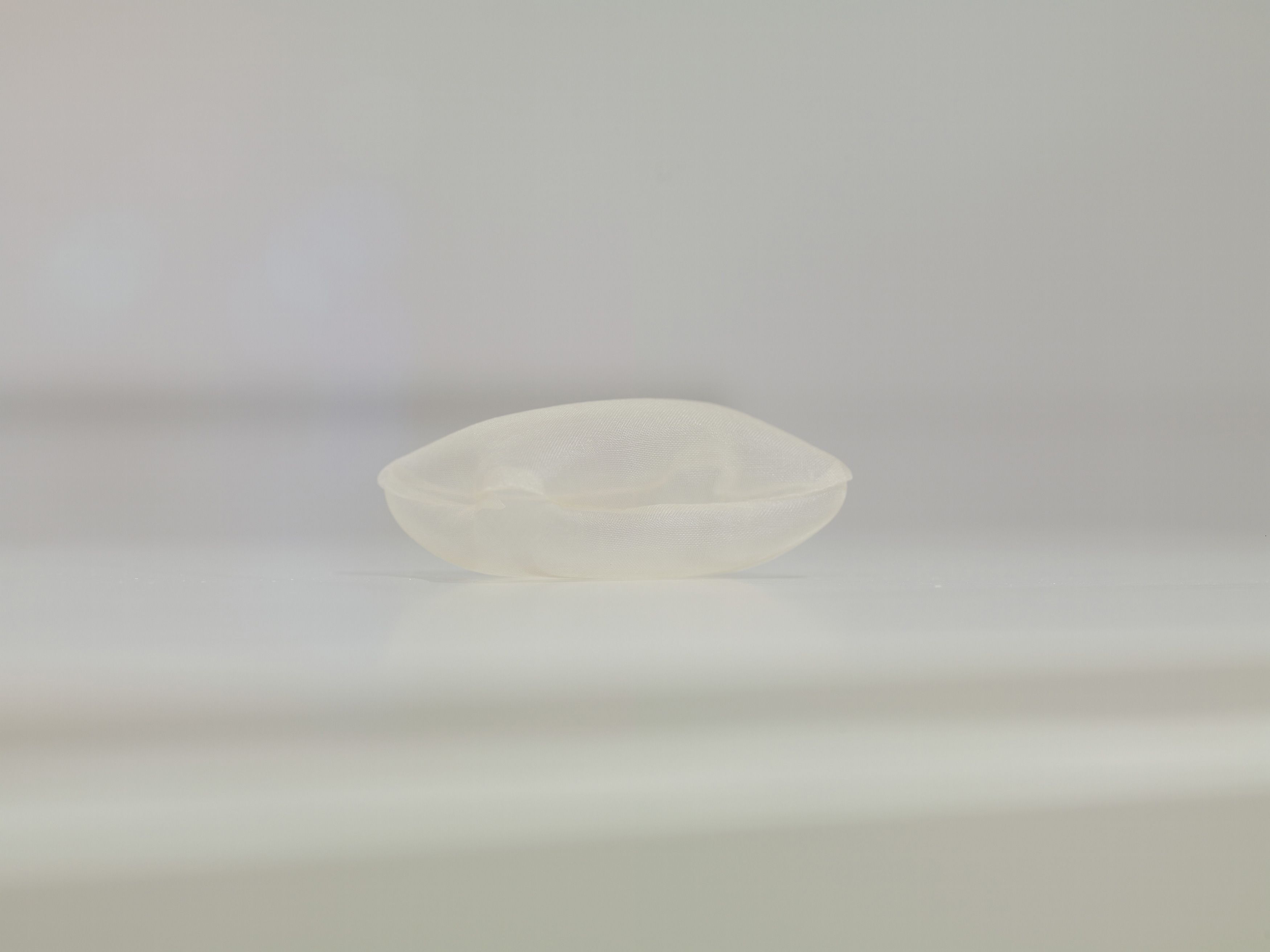 Rei Naito b.1961 / pillow for the dead 1998 / Silk organza, thread, air on medium density fibreboard painted pedestal with perspex cover / Purchased 1999. Queensland Art Gallery Foundation Grant / Collection: Queensland Art Gallery | Gallery of Modern Art / © Rei Naito 