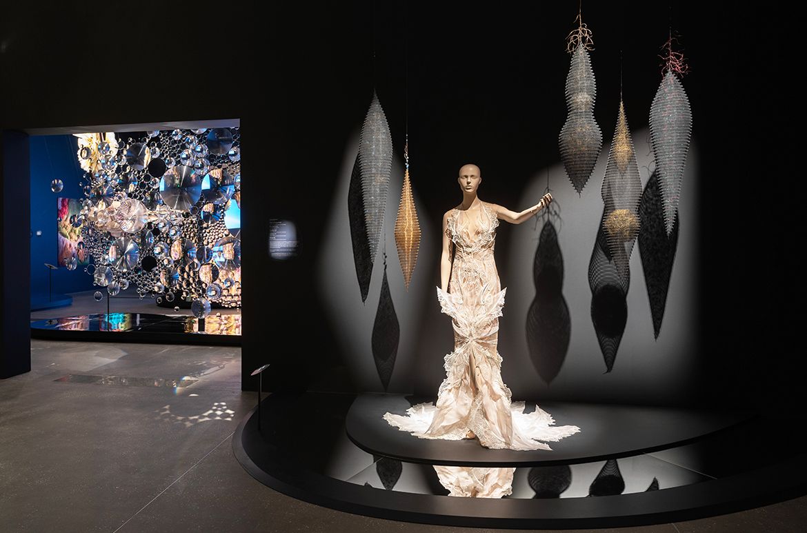 Installation view ‘Iris van Herpen: Sculpting the Senses’, GOMA 2024 featuring Rising and Falling #2 2008; Blue Drop #3 2009; Dark Core 2006; Coalesce 2008; and Strings 2007 by Lanny Bergner / © Lanny Bergner / Photograph: N Umek © QAGOMA