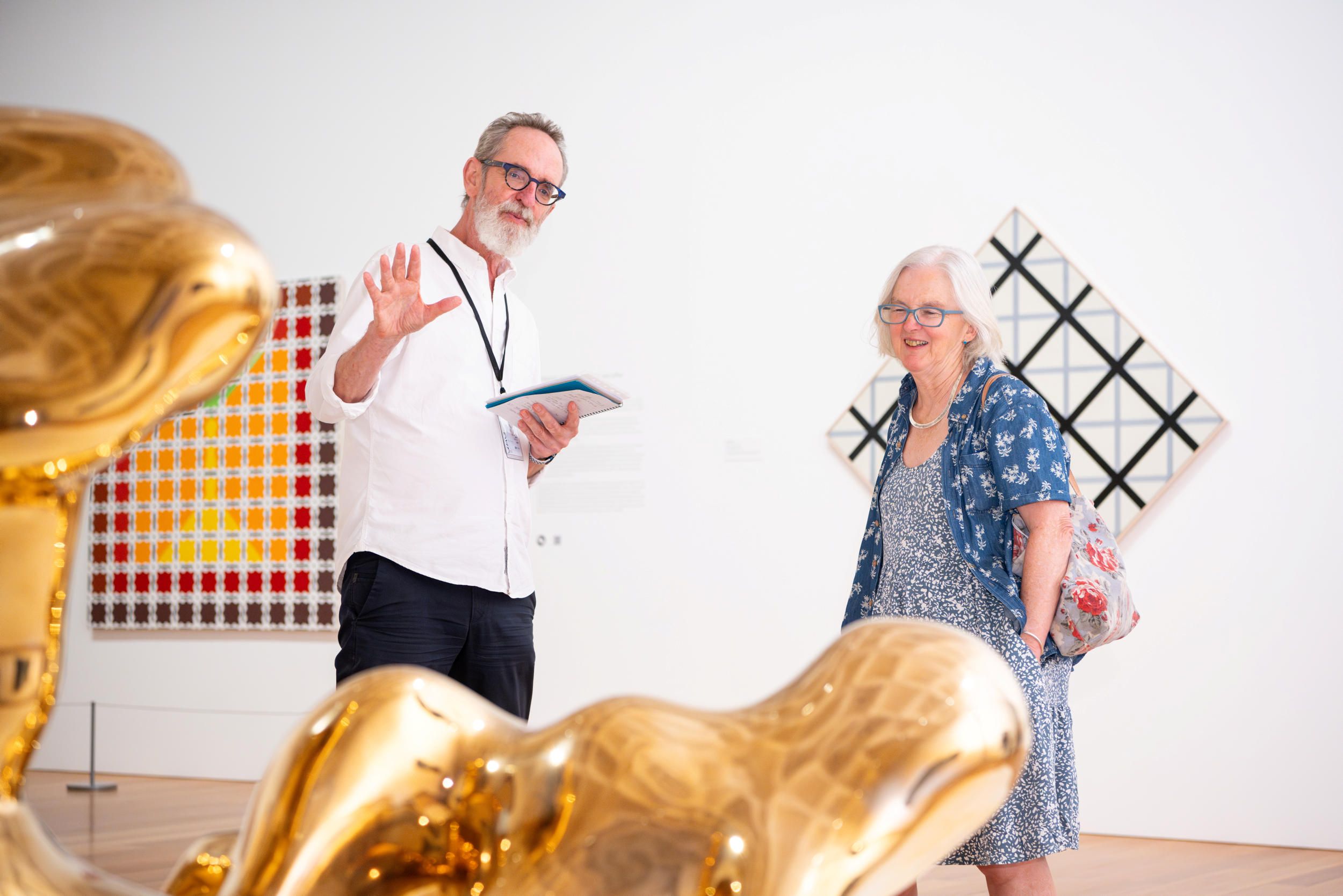 A gallery visitor enjoying a Volunteer Guided tour.

Photograph: Photography by C. Callistemon | QAGOMA