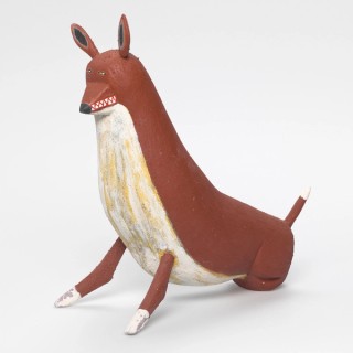 David Marpoondin, Wik-Ngathan/Wik-Me'an people, Australia b.1968 / Ku' (Camp dog) 2010 / Carved milkwood (Alstonia muellerana) with natural pigments, charcoal, synthetic polymer paint and acrylic binder / 33 x 33 x 15cm / Purchased 2010 with funds from the Josephine Ulrick and Win Schubert Diversity Foundation through the QAG Foundation / Collection: Queensland Art Gallery | Gallery of Modern Art / © David Marpoondin