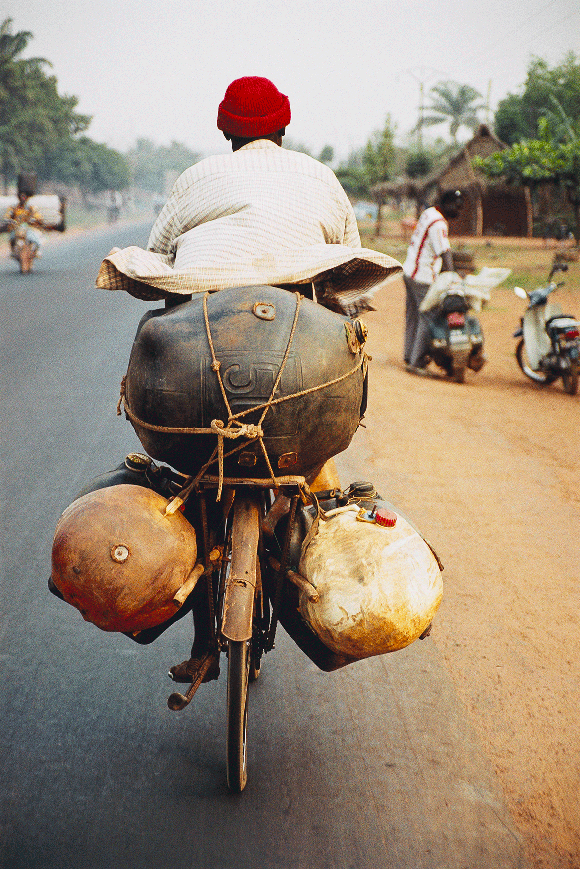 Romuald Hazoumé, Benin b.1962 / Avion de Terre 2004 / Type C photograph on paper / 120 x 80cm (comp.) / Purchased 2009 with funds from the Bequest of Grace Davies and Nell Davies through the QAG Foundation / Collection: Queensland Art Gallery | Gallery of Modern Art / © Romuald Hazoume/ADAGP/Copyright Agency