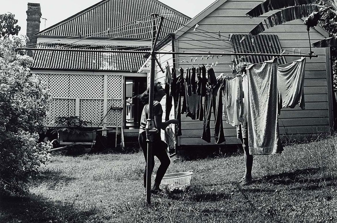 Glen O’Malley, Australia b.1948 / Good Friday 1987, Kelvin Grove, Brisbane – Gerard and his girlfriend hung out his washing (from ‘Journeys north’ portfolio) 1987 / Gelatin silver photograph on paper / 50.8 x 60.6cm / Purchased 1987 with the financial assistance of the Australian Bicentennial Authority to commemorate Australia’s Bicentenary in 1988 / Collection: Queensland Art Gallery | Gallery of Modern Art / © Glen O’Malley
