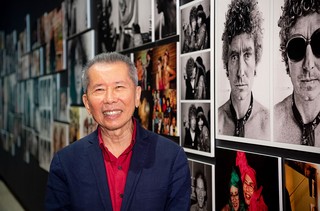 William Yang with the social portraits at the opening of ‘Seeing and Being Seen’