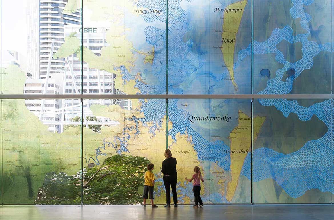 Megan Cope, Qld b.1982 / Fluid Terrain 2012 / Vinyl on glass (art work produced from watercolour and synthetic polymer paint on military maps with digital text) / Site-specific commission for ‘My Country, I Still Call Australia Home: Contemporary Art from Black Australia’ / Courtesy and ©: The artist