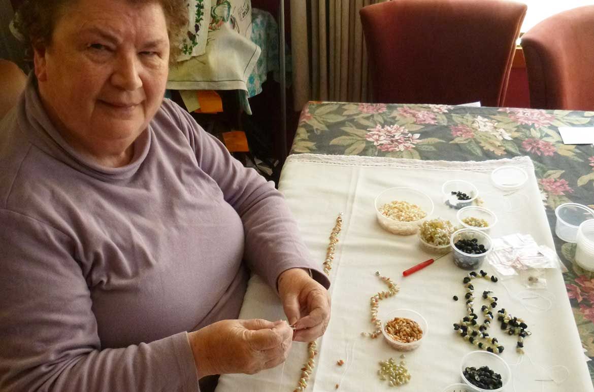 Lola Greeno making her shell necklaces at her home in Tasmania / Image courtesy: Lola Greeno