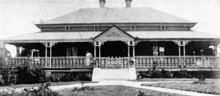 Greylands (1932), at Dennis Street, Indooroopilly was the residence of Lahey family when Vida Lahey painted Monday Morning. David Lahey, a timber merchant leased the house from 1910 / The site was part of a parcel of land purchased by Thomas Lodge Murray-Prior in 1859. In 1876, his friend Graham Lloyd Hart, a city lawyer, purchased a subdivided portion of 43 acres (17 ha) and in the following year built 'Greylands' / Collection: QAGOMA Research Library