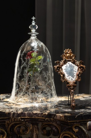 Bill Condon (director), United States; Sarah Greenwood (designer), England / From Beauty and the Beast 2017; Cast: Emma Watson, Dan Stevens, Luke Evans / / ‘Rose in a bell jar’; Glass, plastic, wire; 61 x 36 x 36cm / ‘Mirror’; Mirror, plastic, paint; 45.7 x 21.6 x 5cm / ‘Table’; Wood, marble, artificial snow, resin, plastic; 76.2 x 101.6 x 101.6cm / Courtesy: The Walt Disney Company / © Disney Enterprises, Inc. All Rights Reserved / Photograph: N Umek © QAGOMA