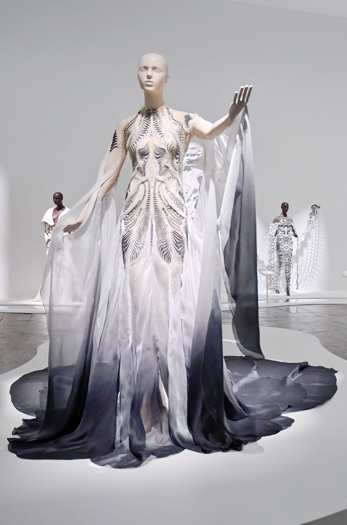 Iris van Herpen, Netherlands b.1984 / Bene Gesserit gown, custom look for Grimes 2021 installed in ‘Iris van Herpen: Sculpting the Senses’, GOMA 2024 / Silk organza, silicone, mirror mylar, tulle / Worn by musician Grimes at the Met Gala, New York, 2021 / Collection: Lauren Amos / © Iris van Herpen atelier / Photograph: C Sanders © QAGOMA
