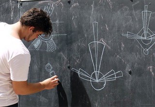 Shawn Davis-Abra testing designs on the Fish Lane chalkboard. Photography by Katherine Ogg (Gilimbaa)